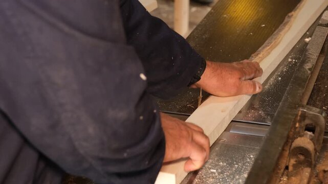 Carpenter Smoothing Wood Board On Industrial Planer Machine