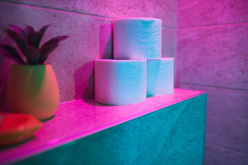 Toilet paper rolls in the bathroom, shallow depth of field and selective focus.