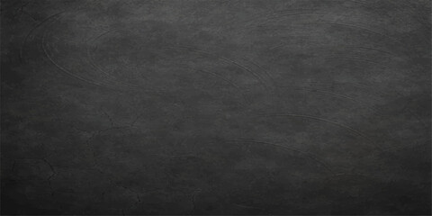 A dark grunge texture of an old black chalkboard background with a rough grey wall pattern and vintage dirty blackboard surface design © MDNUR