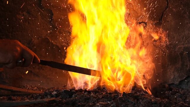 Sparks And Flame Burst From Blacksmith Furnace,