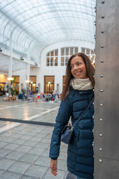 Caucasian Woman in Blue Puffer Coat in Osterreichische Postsparkasse Courtyard