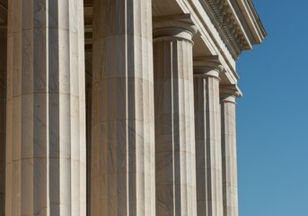 Naklejka premium Timeless architectural detail featuring Ionic columns and polished marble stone structure, emphasizing heritage and ancient design elements, marble, historical, foundation