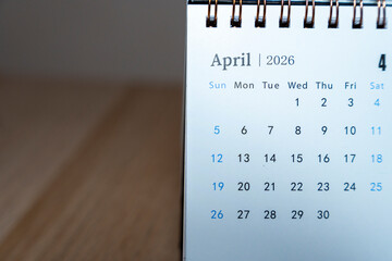 Close-up view of a desk calendar page displaying April 2026, emphasizing dates and days of the week, ideal for planning and scheduling uses throughout the month.
