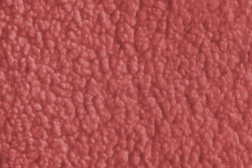 Vibrant red color fabric texture of soft faux fur cloth with fluffy surface, abstract background. Close up, macro of shaggy fabric texture, upholstery material, textile backdrop © katyamaximenko