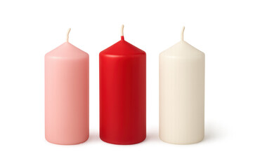 Three pillar candles in red, pink, and white