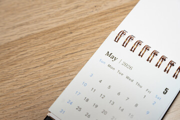 Close-up of a calendar page showing May 2026, with dates and days of the week clearly visible. Ideal for scheduling, planning, and organizational concepts.