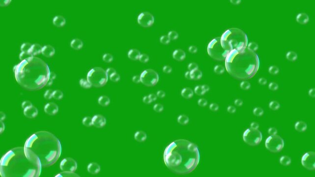 Flying water bubbles green screen motion graphics, 4k, loop. flying soap bubbles on green screen background , vertical orientation. Soap bubbles rise towards a green screen