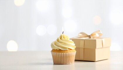 Delightful vanilla cupcake with a single flickering candle glowing brightly beside a charmingly wrapped gift box, perfect for celebrating birthdays and special moments