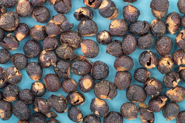 Soap nuts  top view natural detergent background. Eco friendly zero waste concept for organic laundry and household cleaning, ideal for packaging, branding, and wellness content.