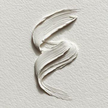 Thick white paint stroke on textured white paper, abstract S shape