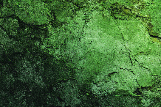 deep green abstract texture with rough stone surface and fissures