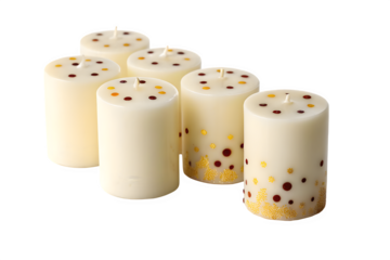A collection of festive decorative cream candles adorned with colorful polka dots and glitter isolated on transparent background