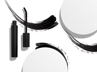 black mascara cosmetic makeup product mockup with flat lay view and ink brush stroke smudge swatch