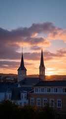 Naklejka premium Tall Church Spires Silhouette Piercing Into Glowing Sunset Sky
