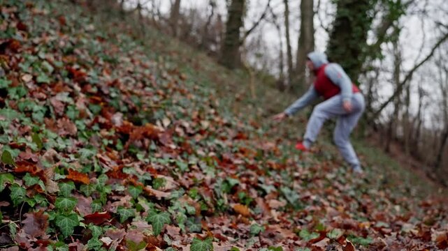  Individual Slowly Rises Up Lush Green Hill, Mountaineer Gradually Moves Upward On Verdant Inclined Terrain, Adventurer Cautiously Progresses Up Emerald Colored Hillside With Careful Footing