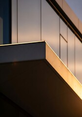 Fototapeta premium Contemporary building facade with unique shadow play and metal panels