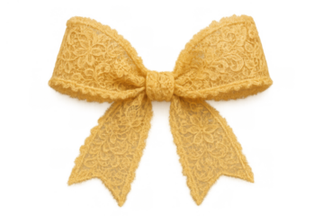 Yellow lace ribbon bow tying a knot, creating a delicate handmade textile decoration with floral pattern