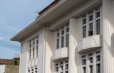 Close-up of the Pos Indonesia building facade. A landmark of Dutch colonial architecture in Bandung, West Java, featuring classic Art Deco style and vertical lines.