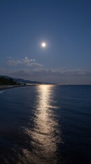 Fototapeta premium Majestic Moonlight Reflection Over Calm Waters at Dusk