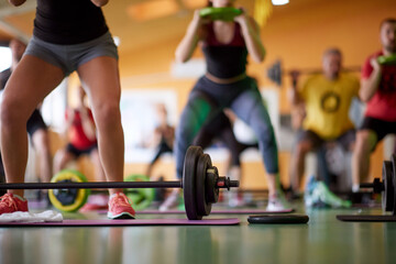 Group training in fitness center with weights. Healthy lifestyle, sport, workout concept
