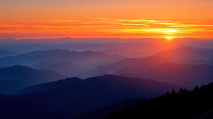 The vibrant sunset paints the mountain range with hues of orange and red, creating a breathtaking vista that captures the serene beauty of nature's majesty.