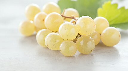Fresh green grapes arranged beautifully on a light background, perfect for healthy eating and food photography.