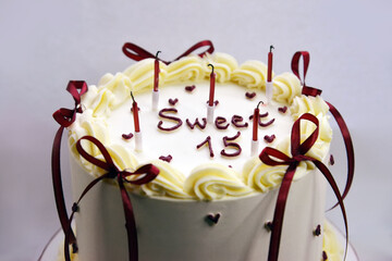 Sweet Fifteen Birthday Cake with Candles and Cream Decoration