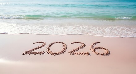 New year 2026 written on the beach sand
