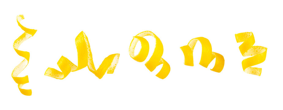 Lemon fruit zest. Fresh yellow organic lemons and a grater isolated on a white background. Citrus zest grater. Lemon twisted peel. Vitamin C. Space for text. Copy space.