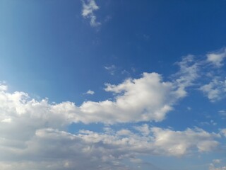 White Fluffy Clouds in a Clear Blue Sky)