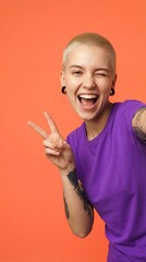 Person winks and holds peace sign against orange background