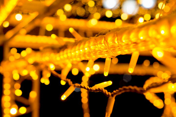 Holiday background. Neon holiday lights in the night. Blurred.