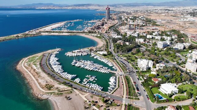 Aerial drone cinematic video of famous luxury South area of Glyfada capital's best-known nightclubs, upscale restaurants and shops, Athens Riviera, Attica, Greece