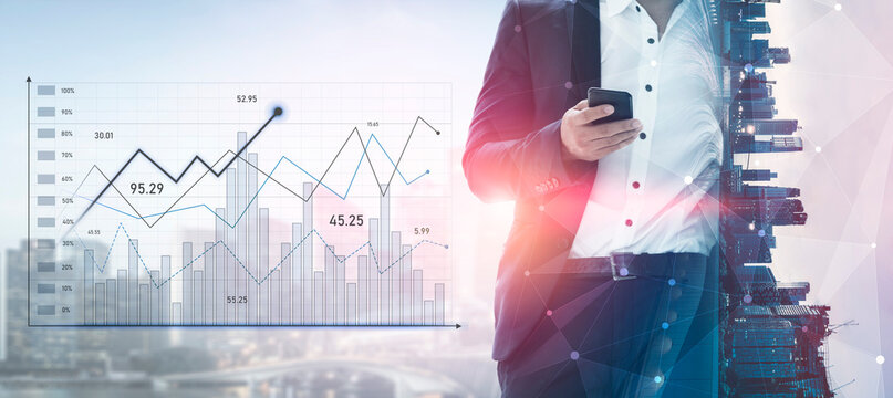 A businessman in a suit analyzes data on a mobile device against a backdrop of graphs and an urban cityscape, showcasing modern finance and analytics in action. Scalp - Powered by Adobe