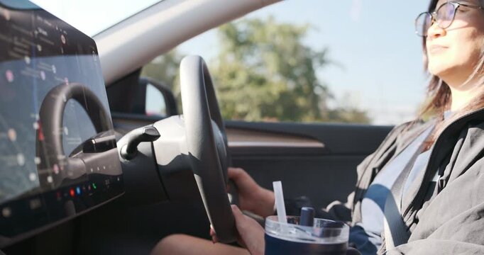 Tourist woman drive EV car use navigator travel trip transport technology