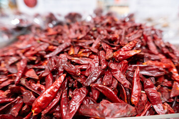 Fresh organic dried red hot chili peppers and spicy cayenne peppers make a healthy cooking ingredient for hot cuisine and market spices