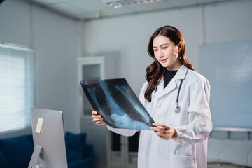 Female doctor analyzing chest x-ray for medical diagnosis