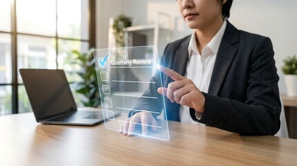 Businesswoman reviewing quarterly results on virtual screen in modern office