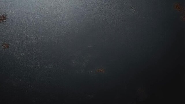 Timelapse of rust progression on dark metallic surface