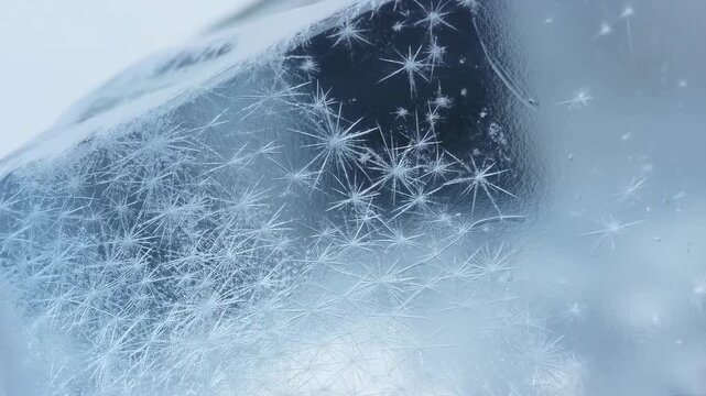 Timelapse of frost formation on ice surface displaying crystalline patterns over time
