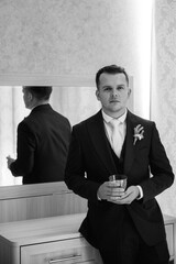 portrait of the groom of a man in the morning before the wedding