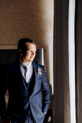 portrait of the groom of a man in the morning before the wedding