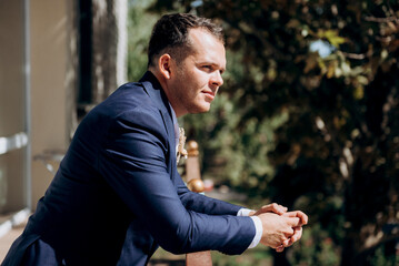 portrait of the groom of a man in the morning before the wedding