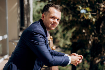 portrait of the groom of a man in the morning before the wedding
