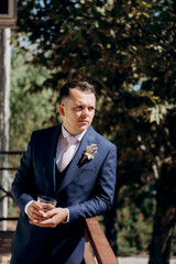 portrait of the groom of a man in the morning before the wedding