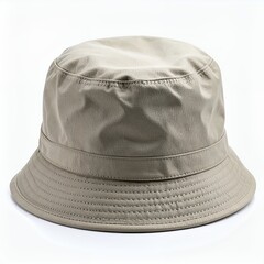 Isolated beige bucket hat against a stark white backdrop showcases neutral fashion item