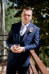 portrait of the groom of a man in the morning before the wedding