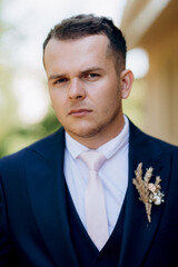 portrait of the groom of a man in the morning before the wedding