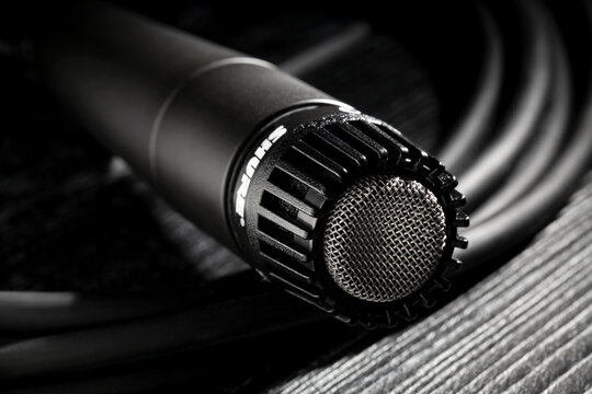 shure sm 57 mic on black wood background