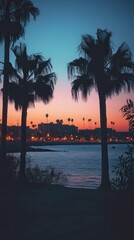 Serene Sunset Over Waterfront with Silhouette of Palm Trees